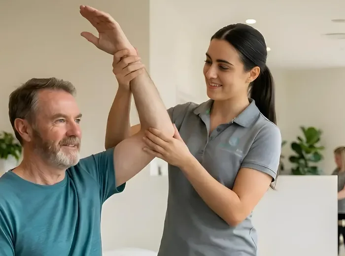 Therapist assisting a patient with a guided limb movement