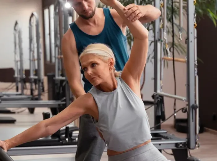Patient performing a supported balance exercise during therapy